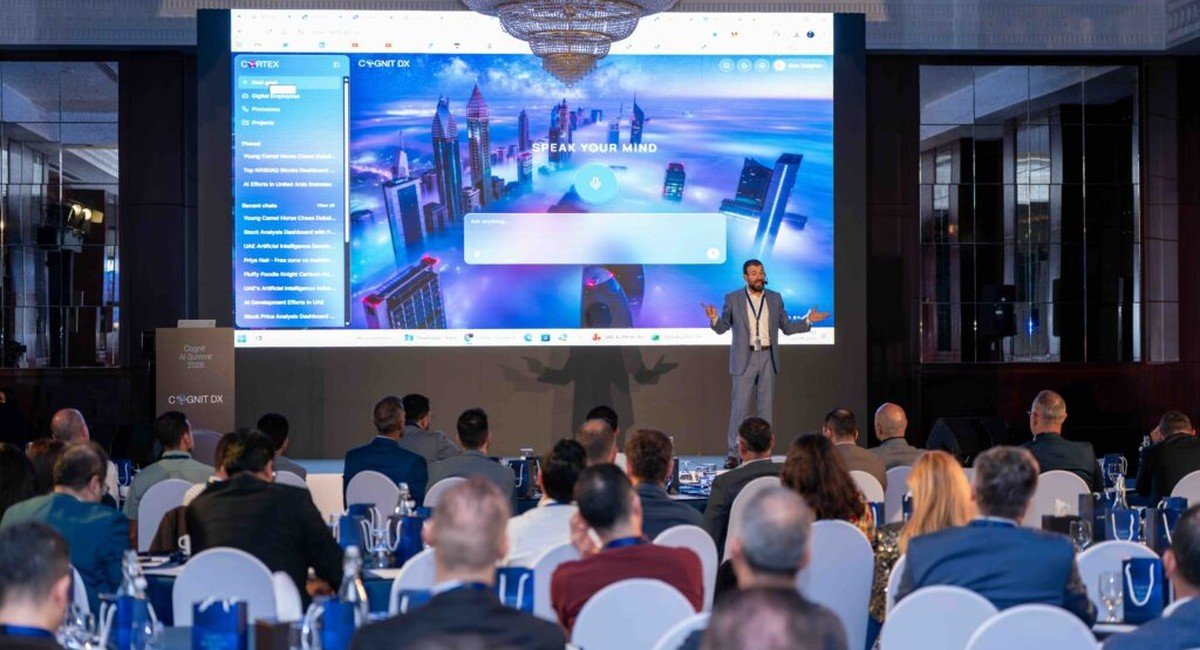 Cognit DX founder Alaa Dalghan demonstrating the Cortex enterprise AI platform on stage at the Cognit AI Summit 2026 in Dubai. Image courtesy Cognit DX.
