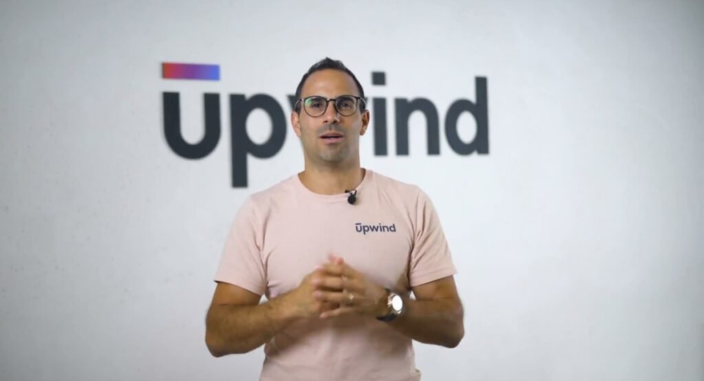 Upwind co-founder and chief executive Amiram Shachar in front of the Upwind logo